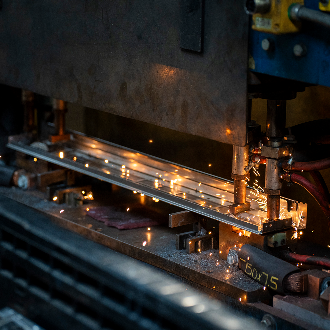 Robotic welding system performing precision welds on metal assemblies