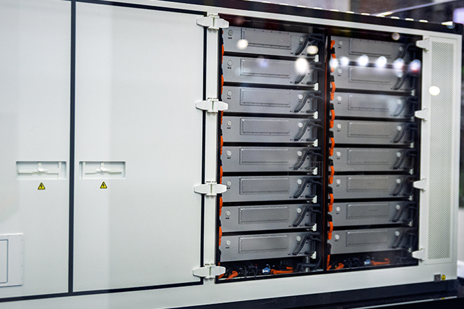 Industrial battery energy storage cabinet showing internal battery modules and electrical storage components inside enclosure